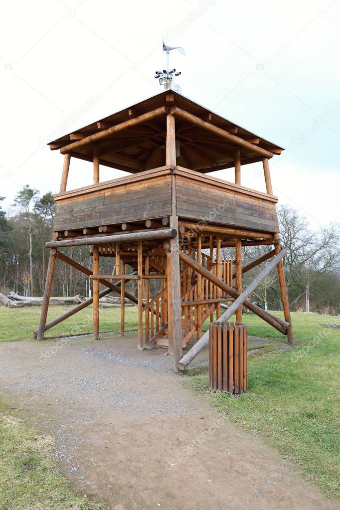Low wooden outlook tower with stairways and cameras on top
