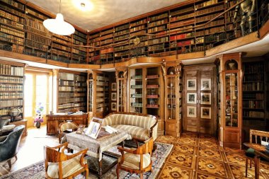 Historic bibliotheca with gallery and cabinets clipart