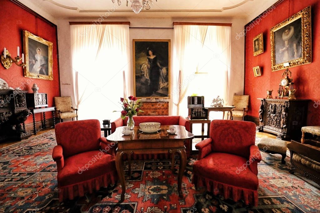 Telc castle interior living room with red chairs