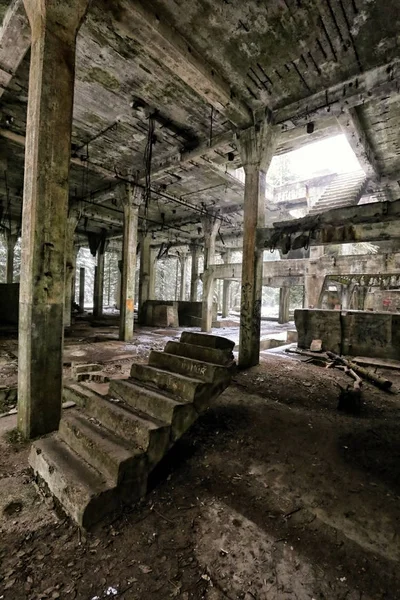 Fallen stairway of the devastated concrete factory — Stock Photo, Image