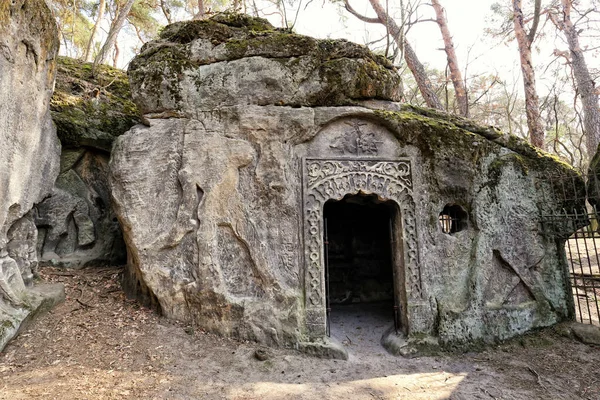 Door portal with ornaments engraved to rock