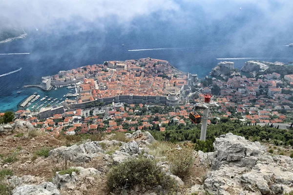 Dubrovnik city in the clouds from the top of mountain — Stock Photo, Image