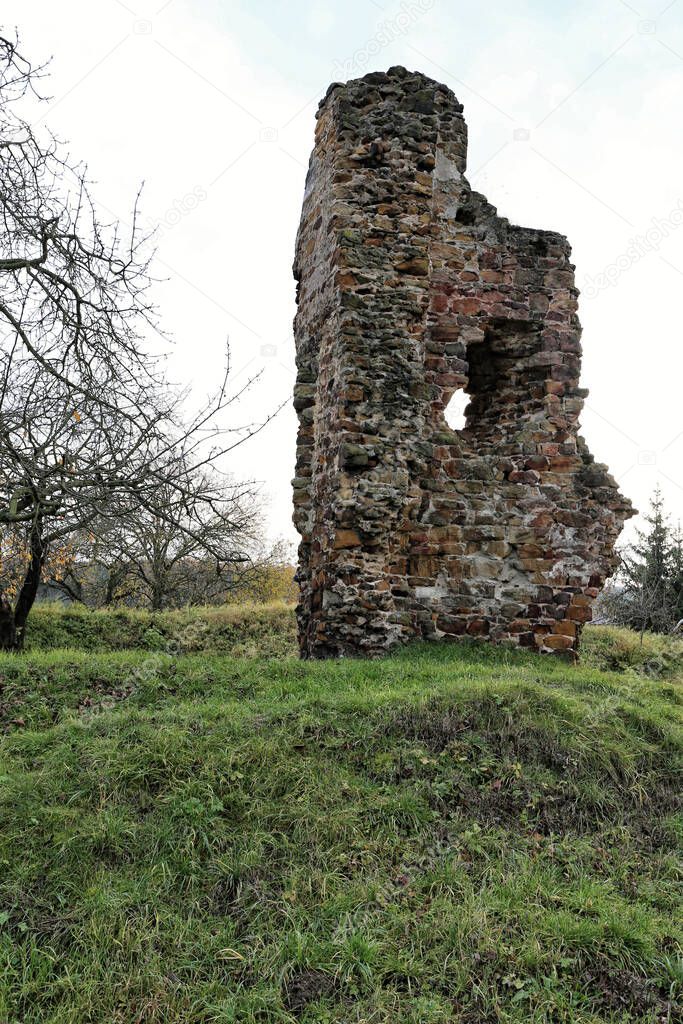 Broken wall of ruined castle Zerotin on the grassy hill