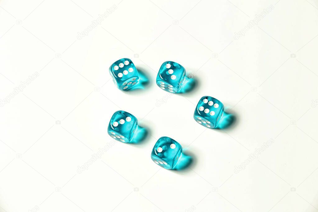 Isolated blue transparent dice showing two, six, and three