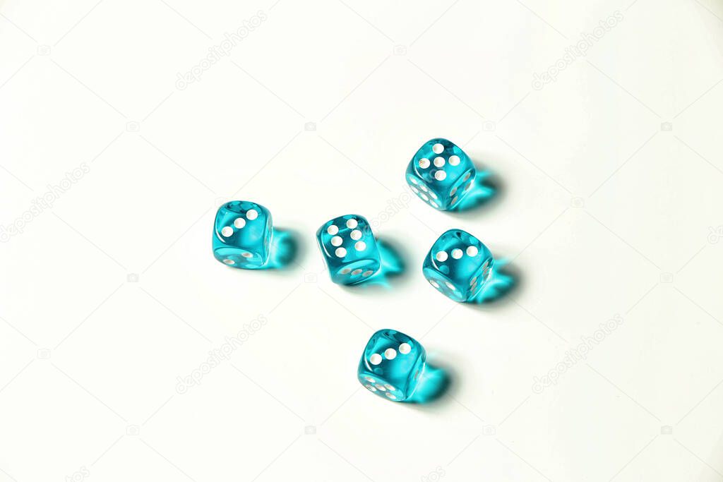Isolated blue transparent dice showing three, five and six