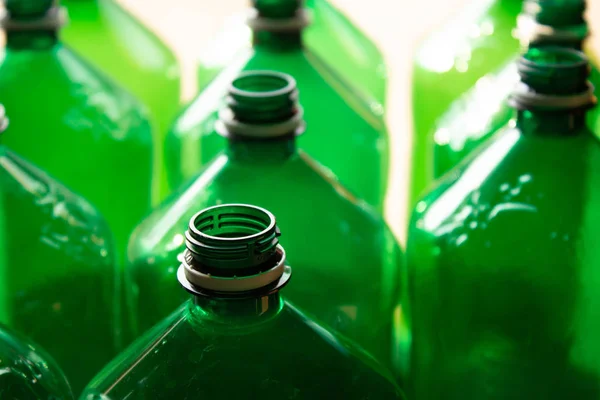 Green plastic bottles close up