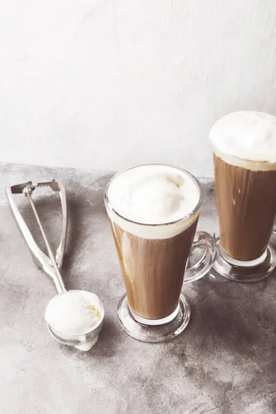 Ice coffee with ice cream on gray background. Toned — Stock Photo, Image