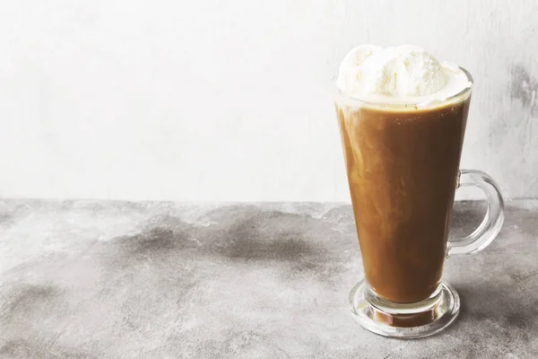 Ice coffee with ice cream on gray background. Copy space. Food b