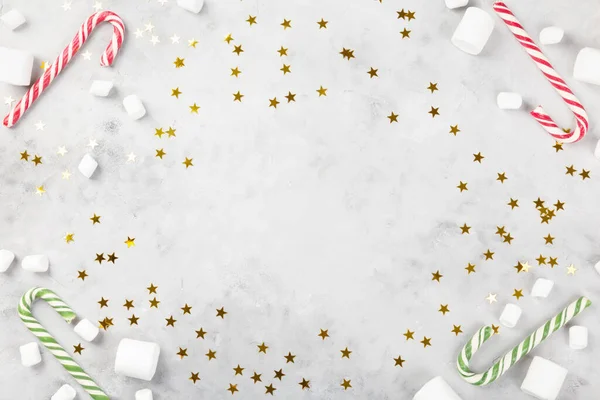 Christmas Composition Caramel Cane Gray Concrete Background Sparkling Stars Concept — Stock Photo, Image