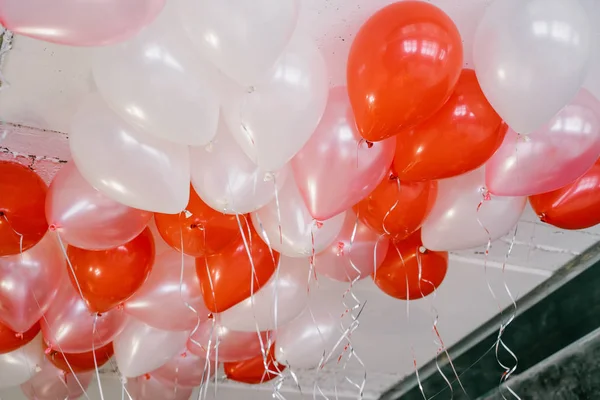 pile of beautiful colorful balloons near ceiling, birthday concept