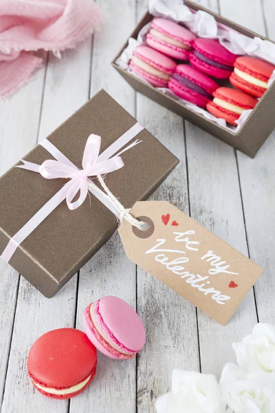 A collection of pink macarons in a gift box for Valentine\'s Day.