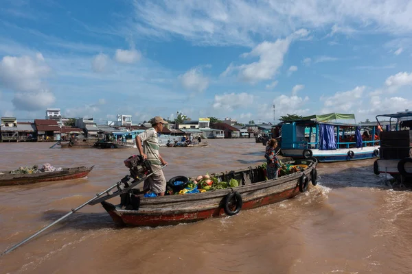 CANTHO city, Vietnam - 08 August 2018: Unidentified people buy and sell on boat, ship in Cai Rang floating market at Mekong River. Royalty free stock image of the floating market or river market in Vietnam