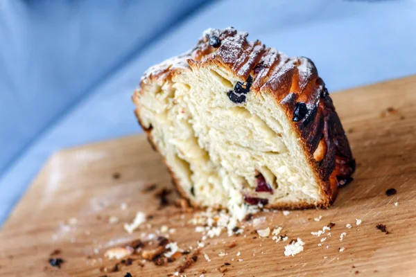 Easter cake-crunch with raisins and candied fruit sliced on the board. Close-up