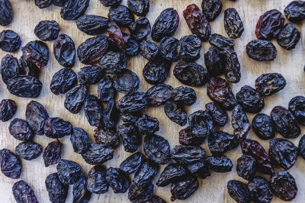 Background from dark blue raisins. Close-up. — Stock Photo, Image