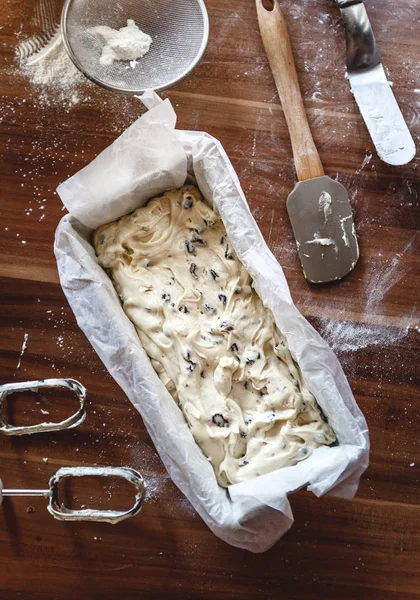 The process of making cake-bread with raisins in a metal baking