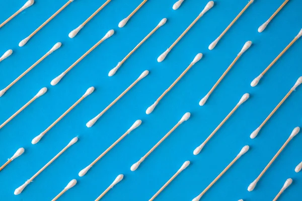 Composition of wooden cotton swabs on a blue-cyan-lilac backgrou — Stock Photo, Image