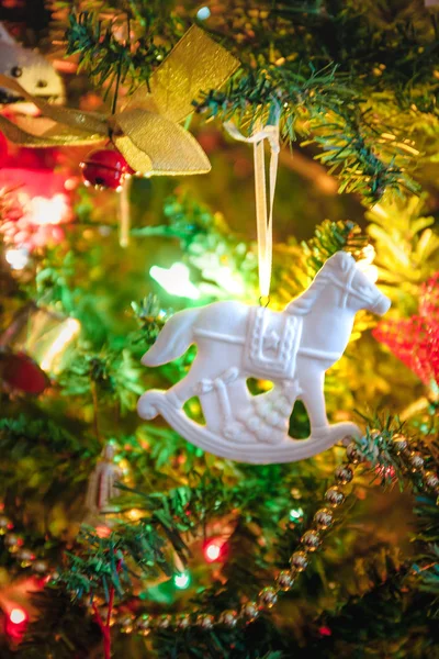 Toy car with gifts, horse, angel, cupcake, Santa\'s clothes for the holiday tree, Christmas toy, life style, garland with lights