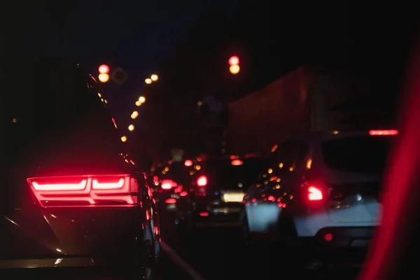 Car taillights in blur on the evening road at rush hour — Stock Photo, Image