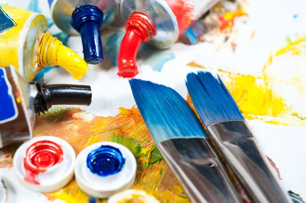 Colourfull oil paints. brushes and palette knife. Royalty Free Stock Images