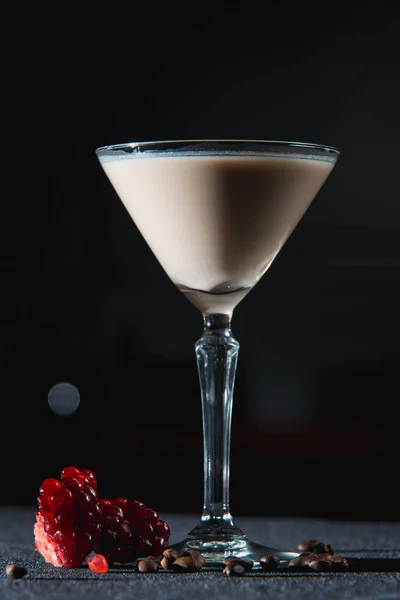 Espresso Martini cocktail, grains of pomegranate on top