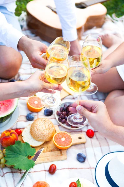 Summer Picnic Basket on the Green Grass in italian garden. Food and drink concept. Friends Party time