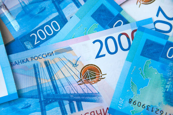 Background of money Russian banknotes currency rouble. in nominal value of two thousand. New tickets bank Russia. Close up. Rich concept