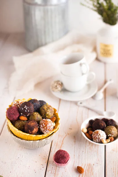 Assorted raw vegan sweet candy gluten-free balls with carob,  co