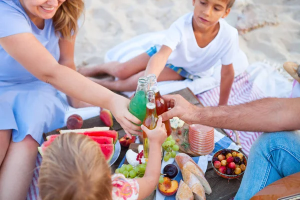 Picnic on the beach at sunset in the style boho, food and drink — Stock Photo, Image