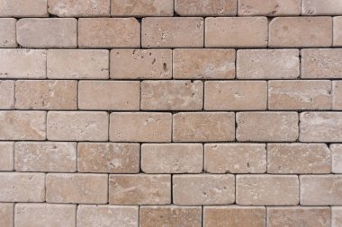 Kahverengi tuğla duvar doku. Aşınmış dokulu tuğla parçası.