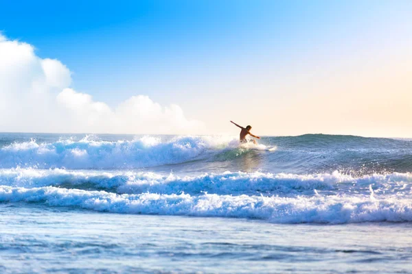 Riding the waves. Bali, Indonesia