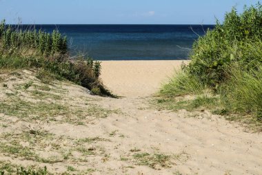 Pathway to beach at Ocean View Beach in Norfolk, Virginia facing Chesapeake Bay. clipart