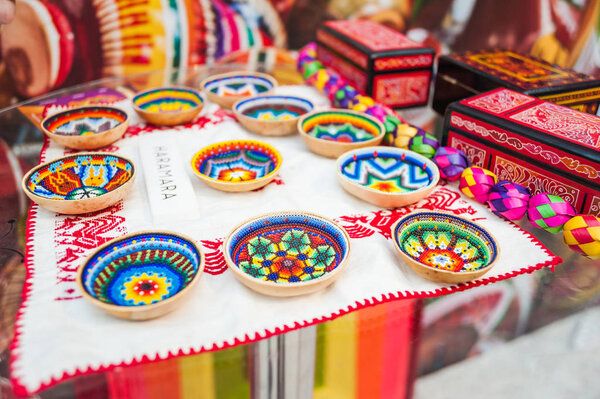 MOSCOW, RUSSIA - June 29, 2018: The 2018 FIFA World Cup. A National house for Mexican fans in Gostiny Dvor. National Souvenirs crafts of the Huichol mosaic of beads