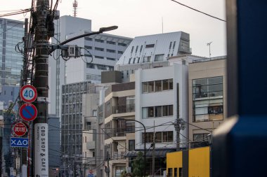 Tokyo, Japan, November 4 2023: Urban Landscape with Road Signs and Electrical Infrastructure clipart