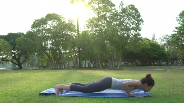 Young Asian Woman Yoga Outdoors Keep Calm Meditates While Practicing — Stock Video