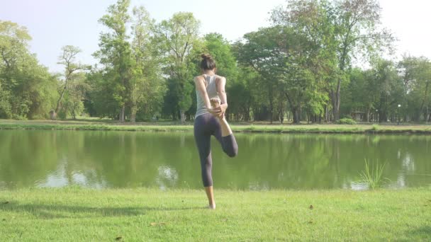 Young Asian Woman Yoga Outdoors Keep Calm Meditates While Practicing — Stock Video