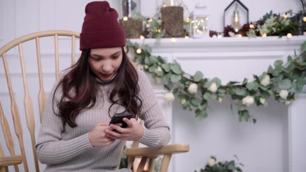 Young Asian Woman Sitting Chair Wrapped Grey Blanket Using Smartphone — Stock Video