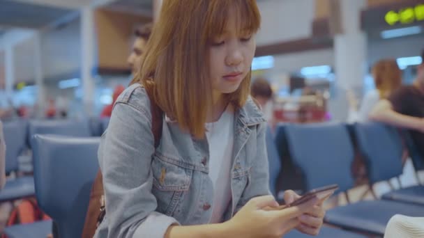 Happy Asian Woman Using Checking Her Smartphone While Sitting Chair — Stock Video