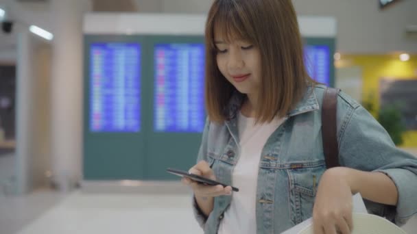 Happy Asian Woman Using Checking Her Smartphone Terminal Hall While — Stock Video