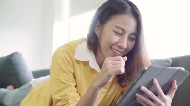 Beautiful Asian Woman Using Tablet Watching Video While Wear Sweater — Stock Video