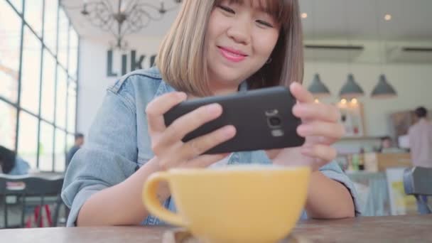 Female Blogger Photographing Green Tea Cup Cafe Her Phone Young — Stock Video