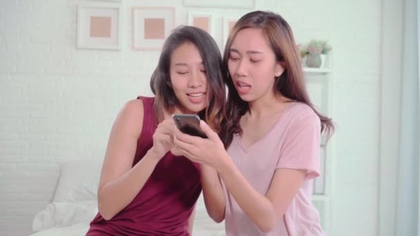 Young Asian Women Lesbian Happy Couple Using Smartphone Checking Social — Stock Video