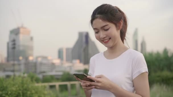 Cheerful Asian Tourist Blogger Woman Using Touchscreen Technology Smartphone While — Stock Video