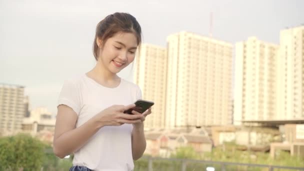 Cheerful Asian Tourist Blogger Woman Using Touchscreen Technology Smartphone While — Stock Video