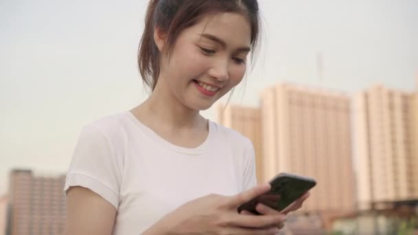 Cheerful Asian Tourist Blogger Woman Using Touchscreen Technology Smartphone While — Stock Video