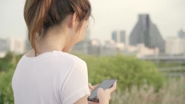 Cheerful Asian Tourist Blogger Woman Using Touchscreen Technology Smartphone While — Stock Video