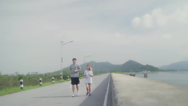 Asian Runner Couple Running Jogging Street Healthy Young Sporty Sweet — Stock Video