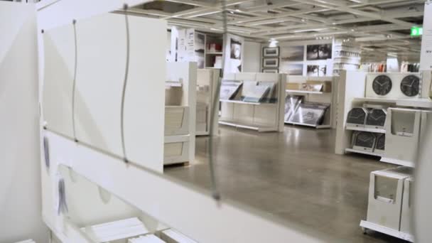 Young Asian Woman Rides Shopping Cart Choosing New Furniture Warehouse — Stock Video