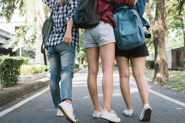 Group of Asian women feeling happy walking together while traveling at park in urban city in Bangkok, Thailand. Lifestyle beautiful friends tourist travel holiday in Thailand concept.