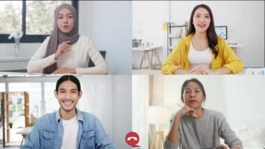 Asyalı iş adamları ve iş kadınları iş dünyasının kullanıcı arayüzü internetteki beyin fırtınası toplantısıyla konuşurken bilgisayarları evden uzakta kullanıyorlar. Corona virüsü için sosyal uzaklık, karantina