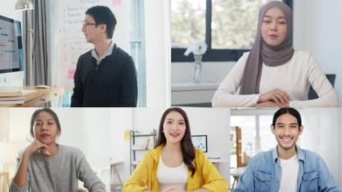 Asyalı iş adamları ve iş kadınları iş dünyasının kullanıcı arayüzü internetteki beyin fırtınası toplantısıyla konuşurken bilgisayarları evden uzakta kullanıyorlar. Corona virüsü için sosyal uzaklık, karantina